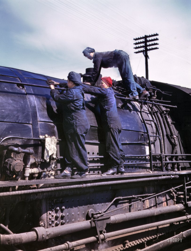 Clinton, Iowa. April 1943. "Chicago &amp; North Western Railroad. Women wipers at the roundhouse cleaning one of the giant H-class locomotives." In the red bandanna: Marcella Hart, seen here in a few other posts. 4x5 Kodachrome transparency by Jack Delano for the Office of War Information. View full size.
