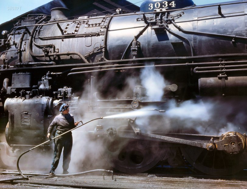 April 1943. "Viola Sievers, one of the wipers at the Chicago & North Western roundhouse, giving a giant "H" class locomotive a bath of live steam at Clinton, Iowa. Mrs. Sievers is the sole support of her mother and has a son-in-law in the Army." Kodachrome transparency by Jack Delano. View full size.