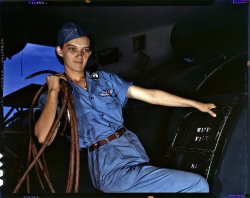August 1942. "With a woman's determination, Lorena Craig takes over a man-size job in Corpus Christi, Texas. Before she came to work at the Naval Air Base she was a department store girl. Now she is a cowler under civil service." 4x5 Kodachrome transparency by Howard Hollem. View full size.