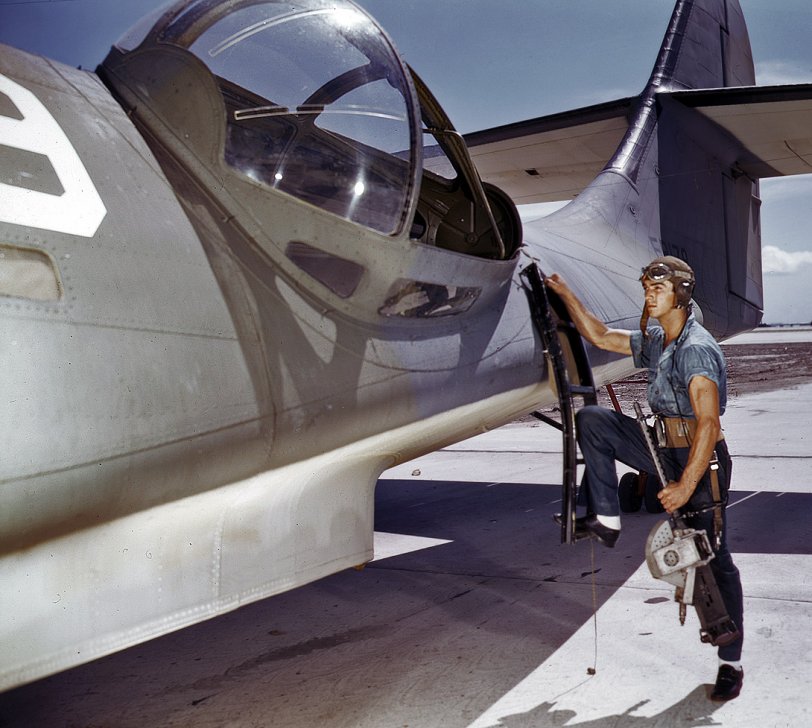 August 1942, Corpus Christi, Texas: "It's an intricate operation, installing a 30-caliber machine gun in a Navy PBY plane, but not too tricky for Jesse Rhodes Waller. He's a Georgia man who's been in the Navy 5-1/2 years. At the Naval Air Base he sees that the flying ships are kept in tip-top shape. Waller is an aviation ordnance mate." View full size. Kodachrome transparency by Howard Hollem.