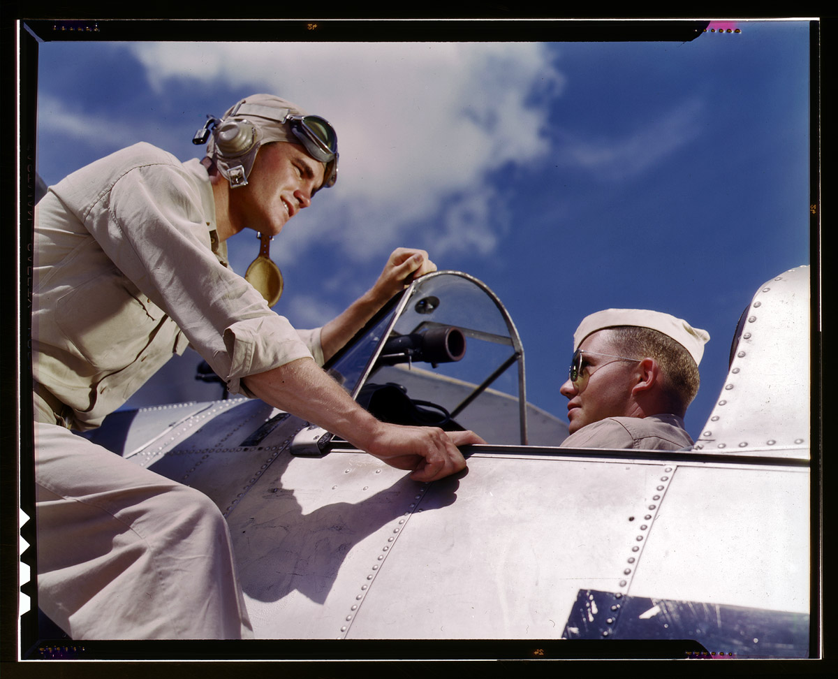 Ensign Noressey and Cadet Thanas at the Naval Air Base, Corpus Christi, Texas. August 1942. View full size. 4x5 Kodachrome transparency by Howard Hollem.