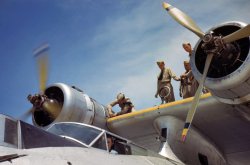 Working on Catalina flying boat at the Corpus Christi Naval Air Base. August 1942. View full size. 35mm Kodachrome transparency by Howard Hollem.