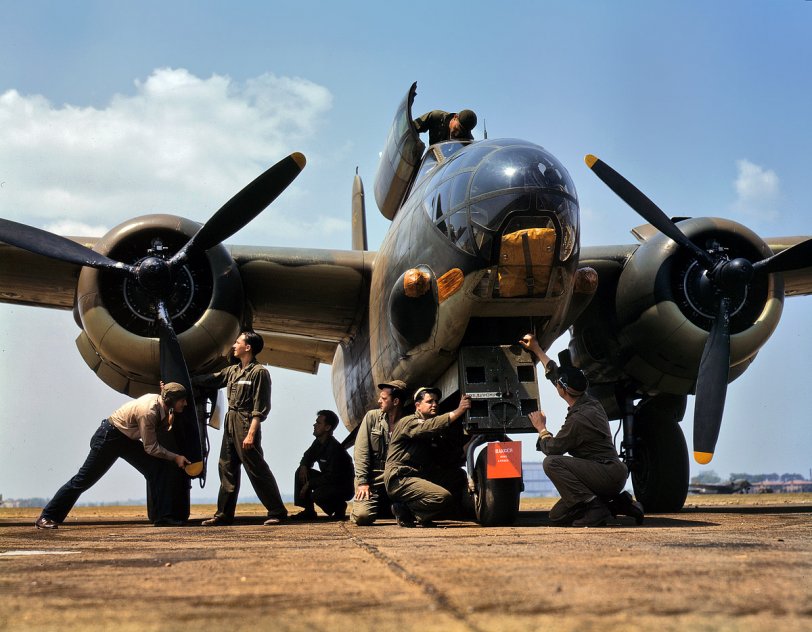 July 1942. Servicing an A-20 bomber at Langley Field, Virginia. View full size. 4x5 Kodachrome transparency by Alfred Palmer.

