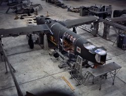 Mating operation on a C-87 transport plane just before it comes to the pre- assembly line at the Consolidated Aircraft Corporation plant, Fort Worth, Texas. October 1942. View full size. Kodachrome transparency by Howard Hollem.