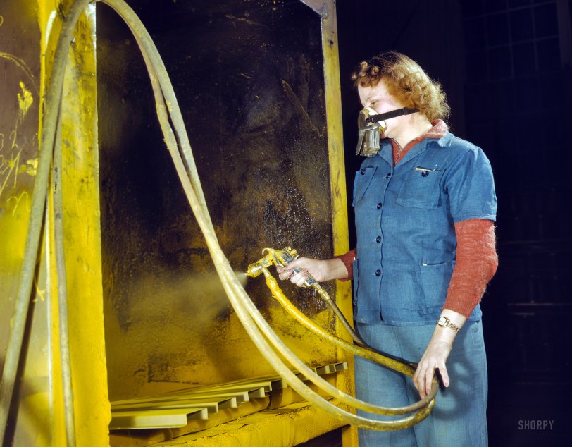 February 1943. Milwaukee, Wisconsin. "War production workers at the Heil Co. making gasoline trailer tanks for the Army Air Corps. Elizabeth Little, age 30, mother of two, spraying small parts. Her husband runs a farm." 4x5 Kodachrome transparency by Howard Hollem, Office of War Information. View full size.
