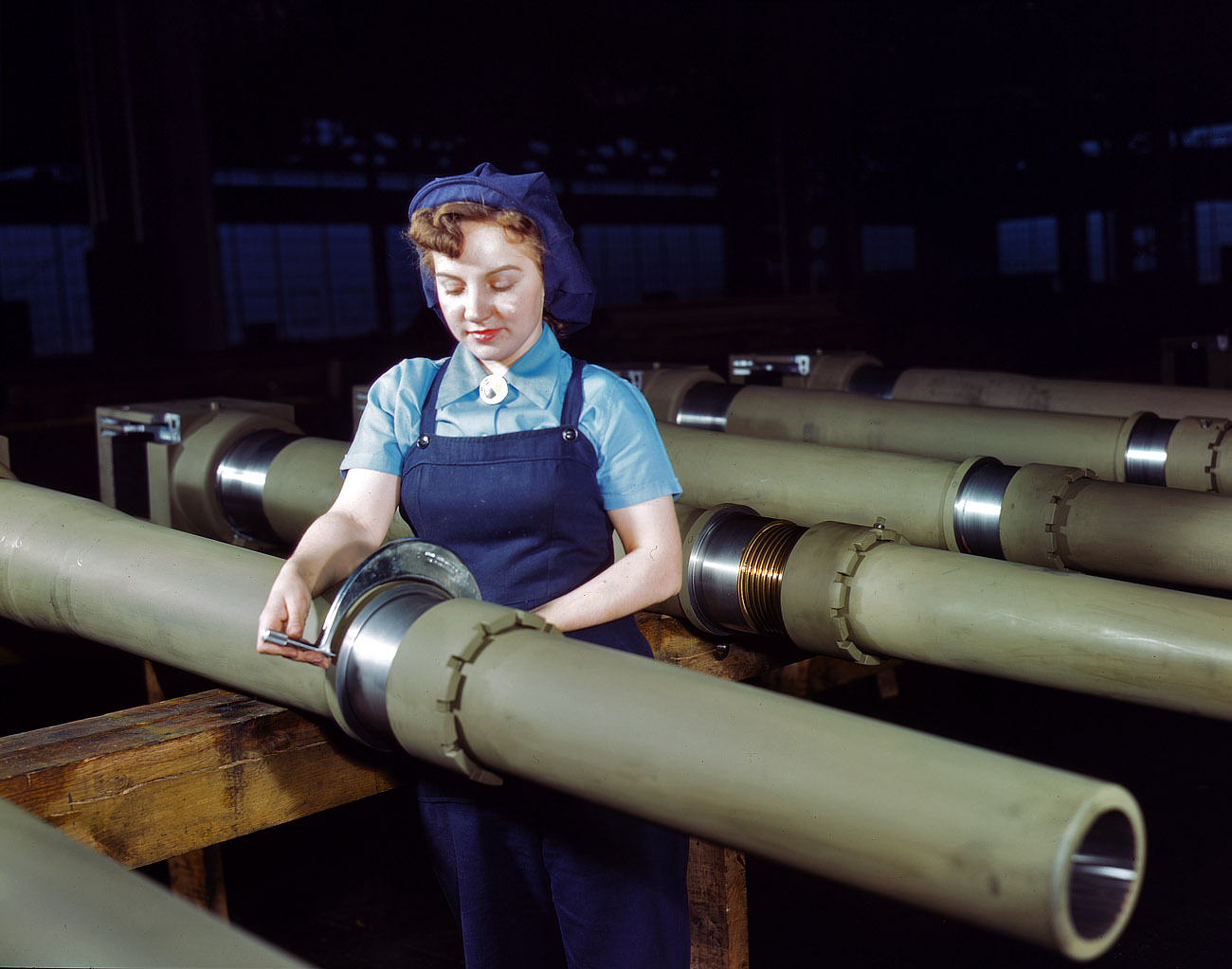 February 1943. "Mrs. Mary Betchner measuring 105mm howitzers at the Milwaukee, Wisconsin, plant of the Chain Belt Company. Her son is in the Army; her husband and daughter are in war work." View full size. 4x5 Kodachrome transparency by Howard Hollem for the Office of War Information.