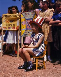 May 1942. Emily Schwak, Queen of the May at the Beecher Street School in Southington, Connecticut, where the children put on a patriotic display. View full size. 4x5 Kodachrome transparency by Fenno Jacobs.