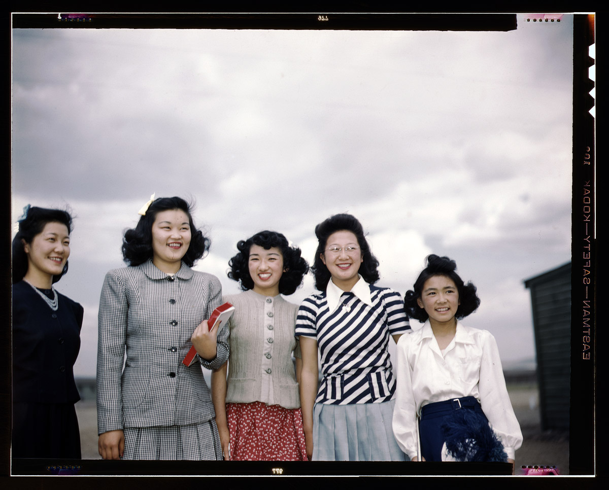 Five smiling women. Tule Lake Relocation Center, Newell, California. 1942 or 1943. Photographer unknown.  View full size.
