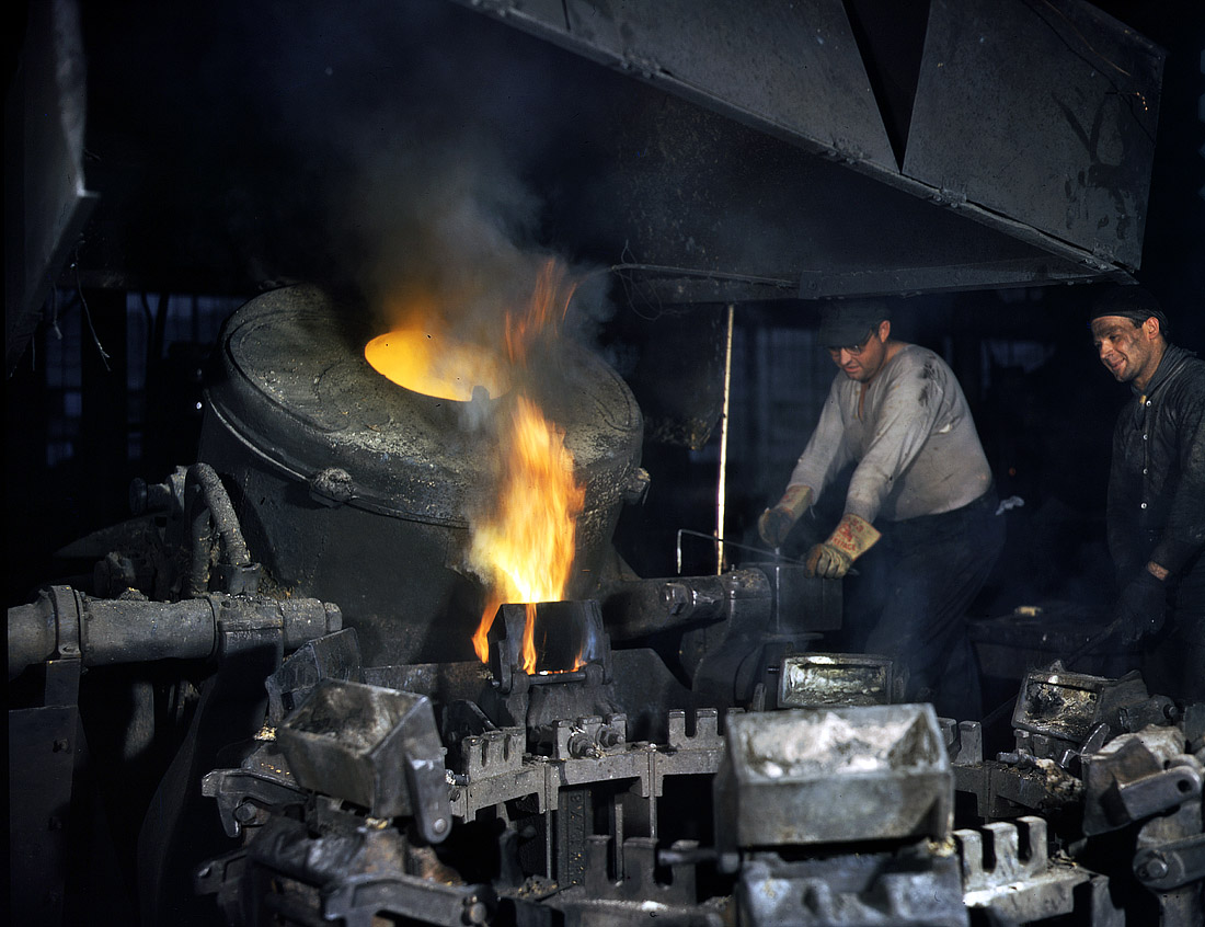 February 1942. "Casting a billet from an electric furnace, Chase Brass and Copper Co., Euclid, Ohio. Modern electric furnaces speeding the production of brass and other copper alloys for national defense. Here the molten metal is poured or cast from the tilted furnace into a mold to form a billet. The billet later is worked into rods, tubes, wires or special shapes for a variety of uses." View full size. 4x5 Kodachrome transparency by Alfred Palmer for the Office of War Information.