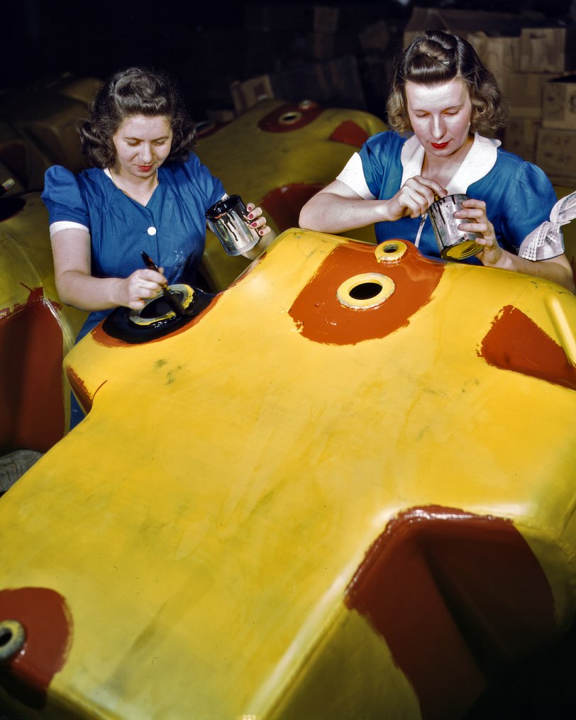 February 1942. B.F. Goodrich plant. "Not only as nurses behind the battle lines, but as workers in the factories producing important war goods, women are doing much to win this war and to spare the lives of the men doing the actual fighting. These girls are preparing a metal fuel tank to receive a bullet-sealing cover, an important new safety development to military aviation." View full size. 4x5 Kodachrome transparency by Alfred Palmer for the Office of War Information.
