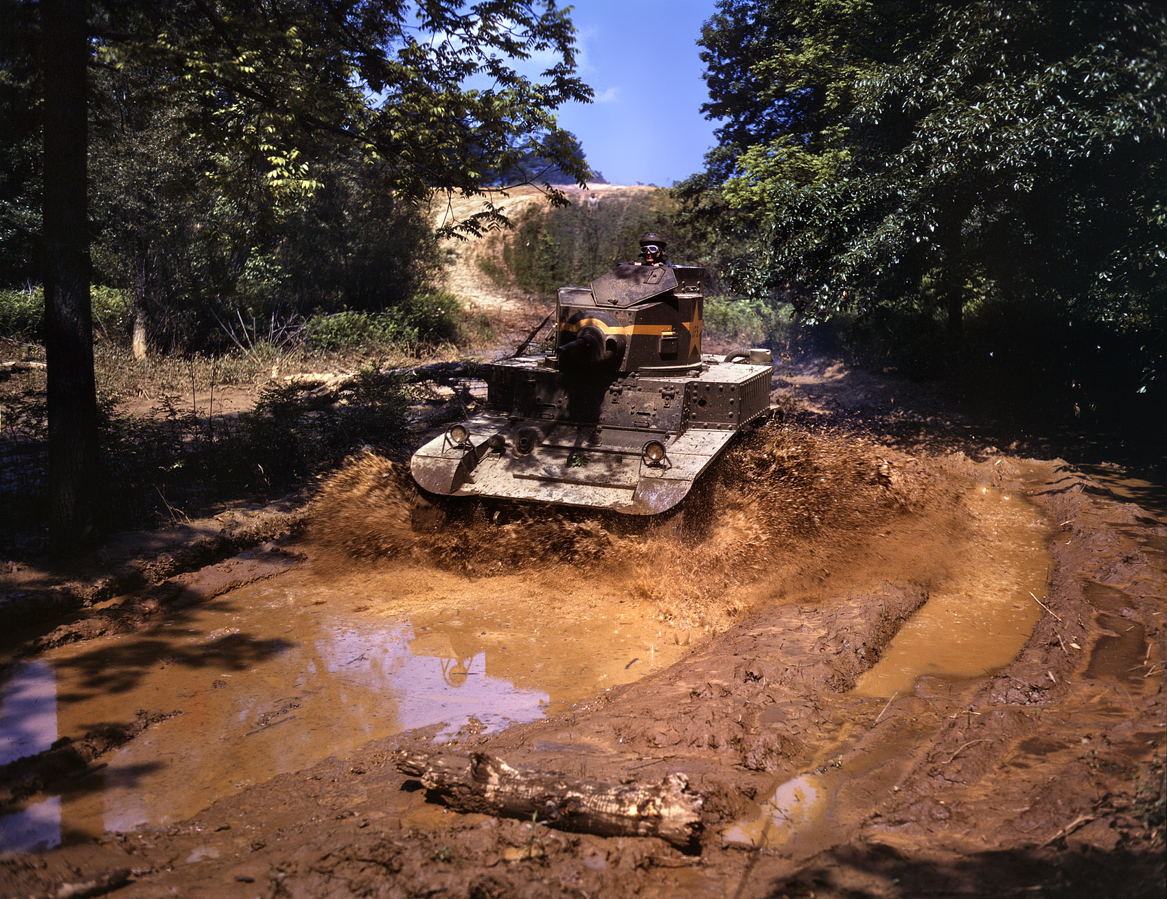 Fort Knox, June 1942. "Light tank going through water obstacle." View full size. 4x5 Kodachrome transparency by Alfred Palmer, Office of War Information.