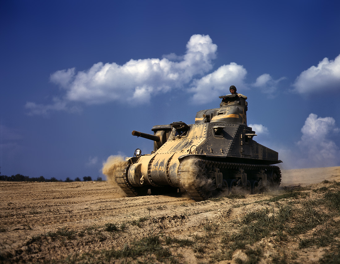 June 1942. M-3 tank in action at Fort Knox, Kentucky. View full size. 4x5 Kodachrome transparency by Alfred Palmer, Office of War Information.