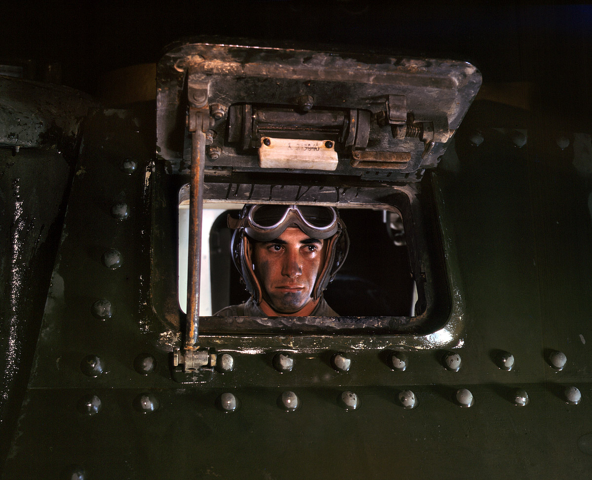 June 1942. Army tank driver at Fort Knox, Kentucky. View full size. 4x5 Kodachrome transparency by Alfred Palmer for the Office of War Information.