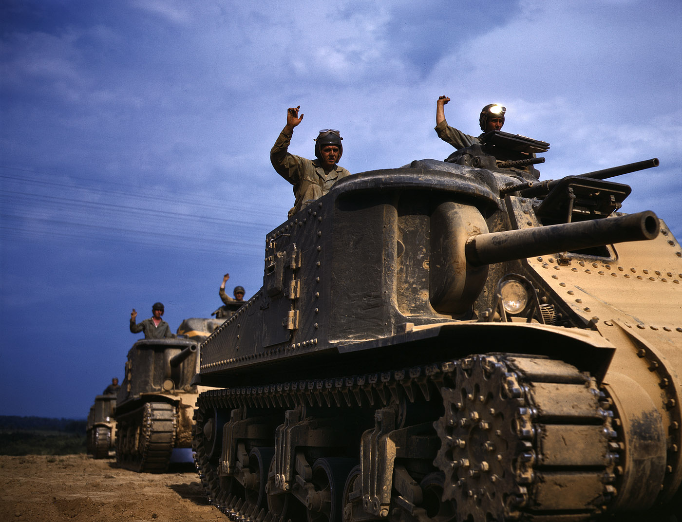 June 1942. M-3 tank crews at Fort Knox, Kentucky. View full size. 4x5 Kodachrome transparency by Alfred Palmer, Office of War Information.