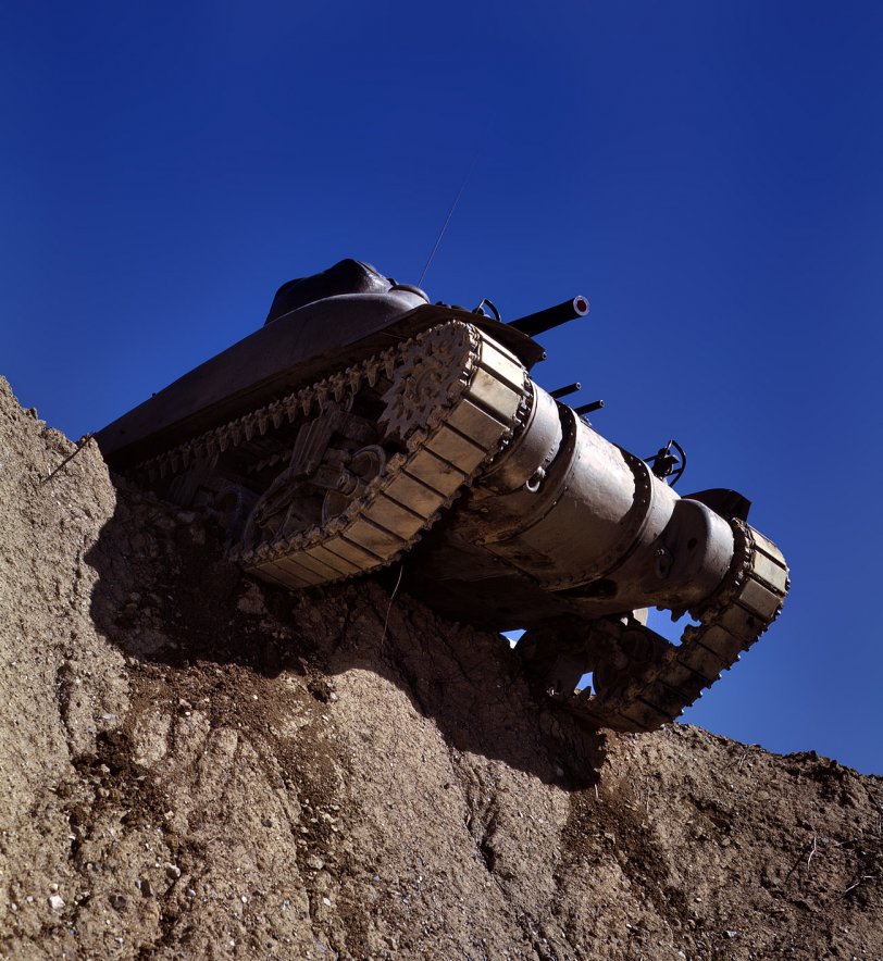 June 1942. An M-4 tank at Fort Knox, Kentucky. View full size. 4x5 Kodachrome transparency by Alfred Palmer for the Office of War Information.
