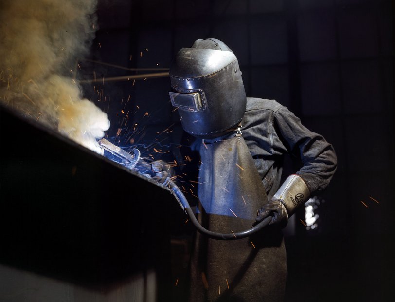 June 1942. Boiler welder at Combustion Engineering in Chattanooga, Tennessee. View full size. 4x5 Kodachrome transparency by Alfred Palmer.
