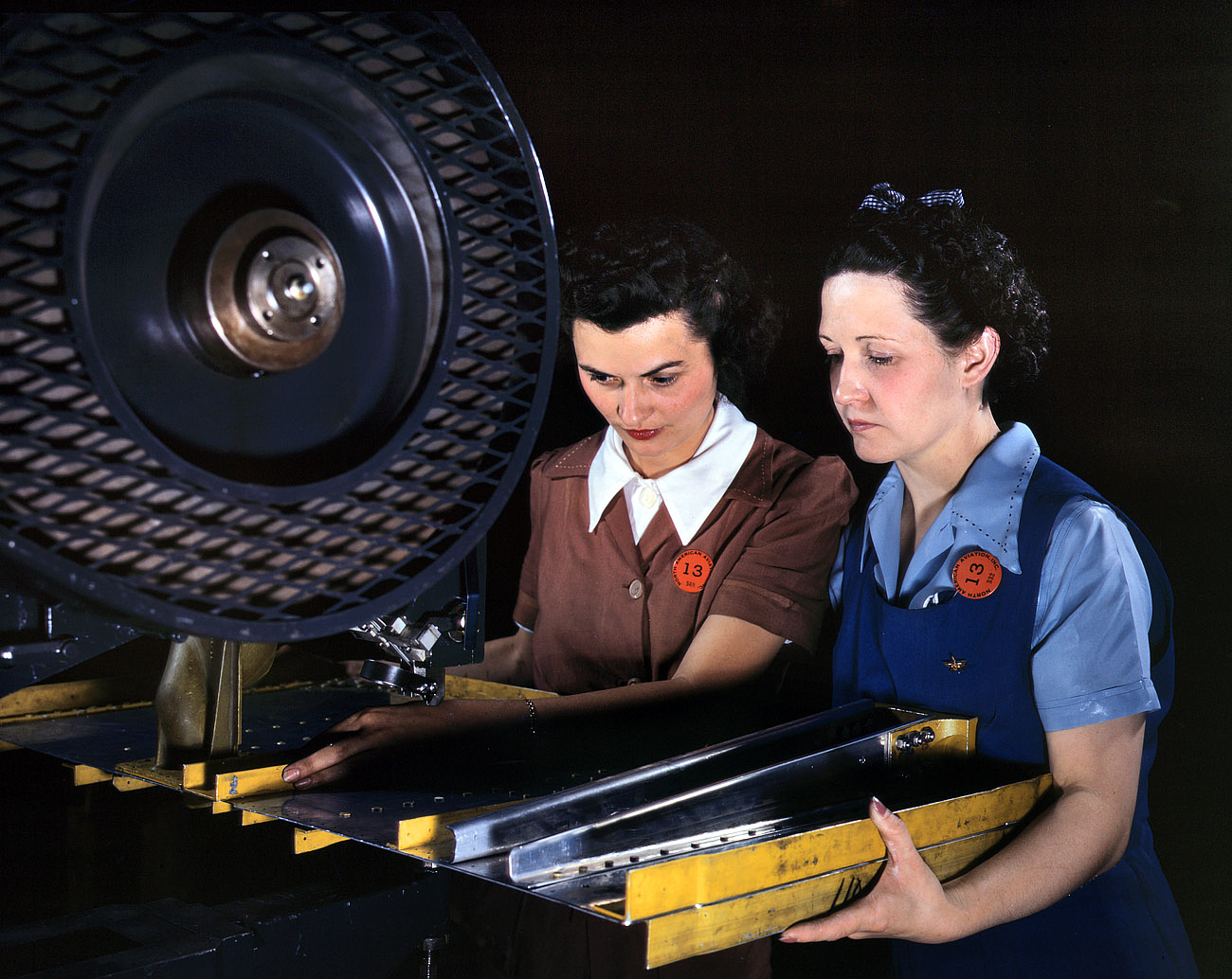 June 1942. Inglewood, California. "Punching rivet holes in a frame member for a B-25 bomber at North American Aviation." View full size. 4x5 Kodachrome transparency by Alfred Palmer for the Office of War Information.