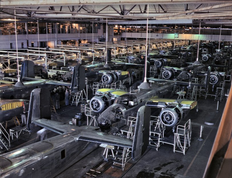 1942. "B-25 bomber final assembly line at North American Aviation works, Inglewood, Calif." Kodachrome transparency by Alfred Palmer. View full size.