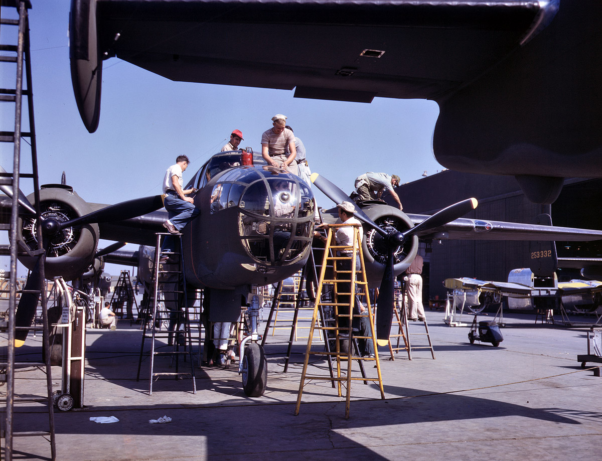 October 1942. Final assembly for a B-25 bomber at North American Aviation, Inglewood, Calif. View full size. Kodachrome transparency by Alfred Palmer.