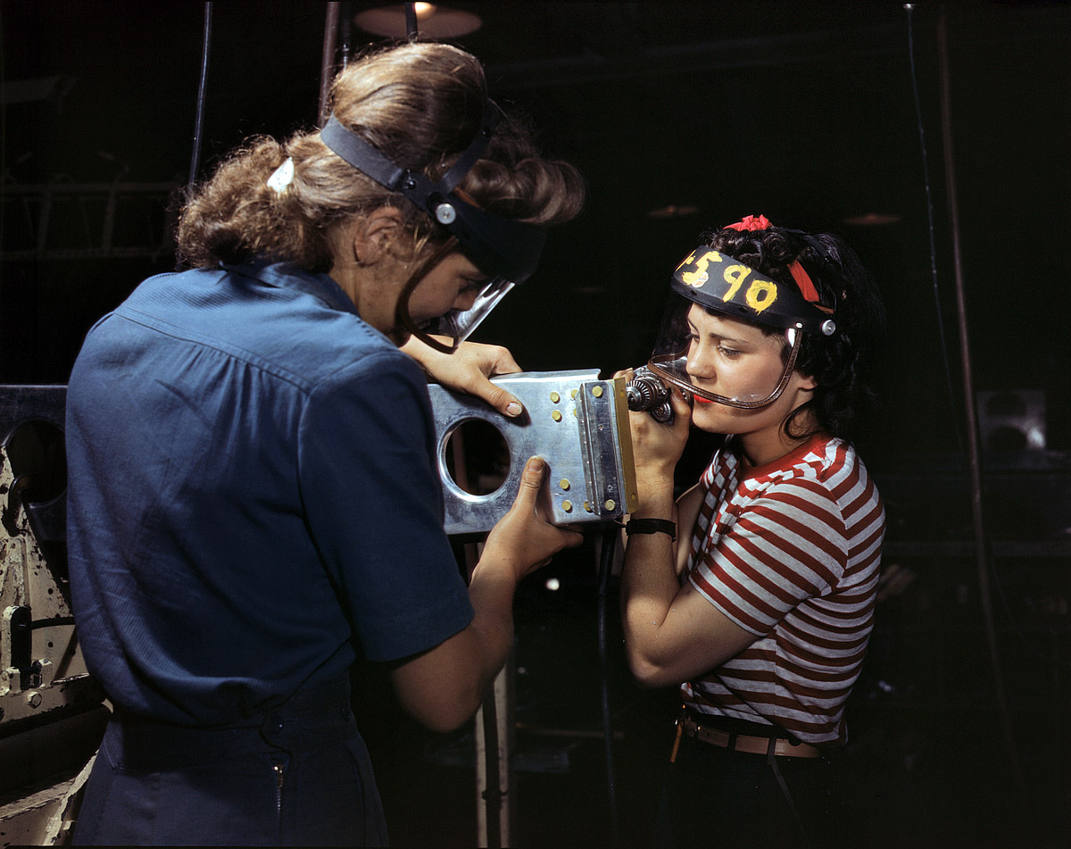 October 1942. North American Aviation workers assembling wing component for a P-51 fighter. View full size. 4x5 Kodachrome transparency by Alfred Palmer.