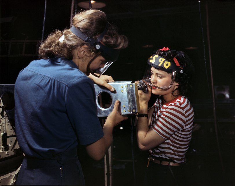 October 1942. North American Aviation workers assembling wing component for a P-51 fighter. View full size. 4x5 Kodachrome transparency by Alfred Palmer.
