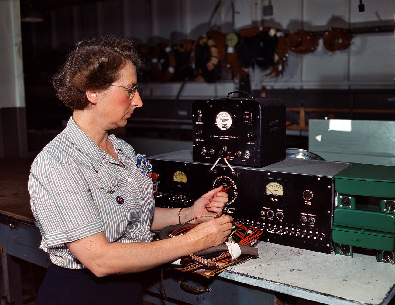 October 1942. "Testing electric wiring at Douglas Aircraft Company. Long Beach, California." View full size. 4x5 Kodachrome transparency by Alfred Palmer.