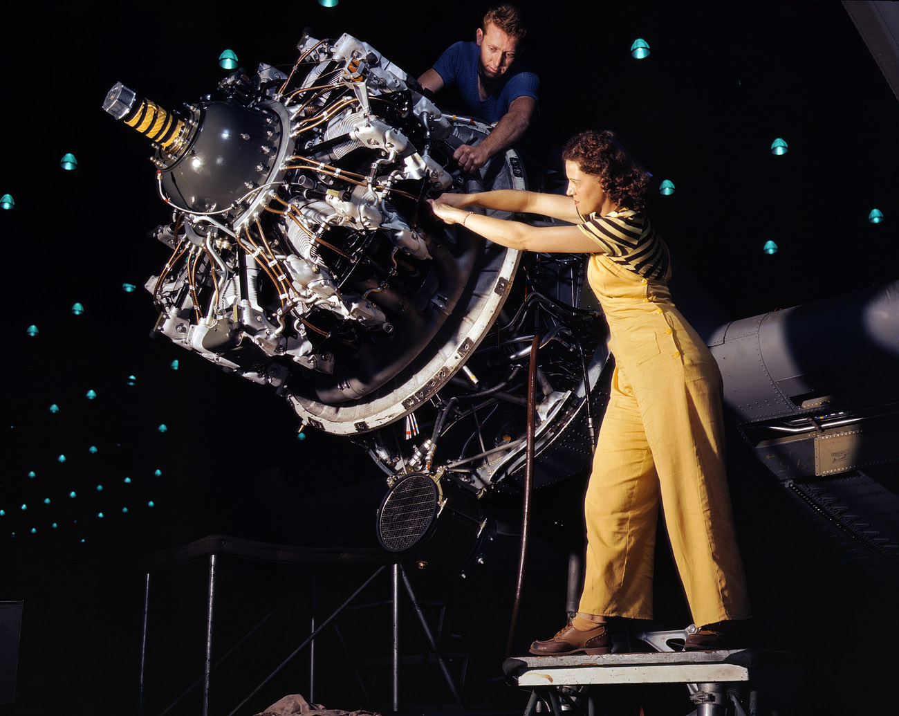October 1942. Long Beach, California. "Women are trained to do precise and vital engine installation detail in Douglas Aircraft Co. plants." View full size. 4x5 Kodachrome transparency by Alfred Palmer for the Office of War Information.