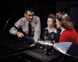 September 1942. Students at Washington High School in Los Angeles training for specific contributions to the war effort. Instructor Ralph Angar explains propeller characteristics to students in the aeronautics class. View full size. 4x5 Kodachrome transparency by Alfred Palmer, Office of War Information.