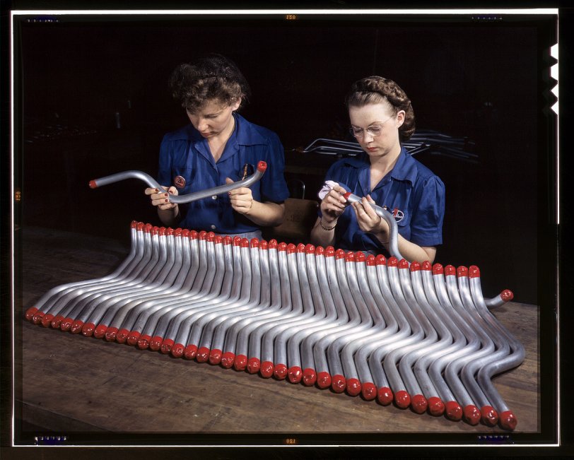 February 1943. "Capping and inspecting tubing that goes into the manufacture of the 'Vengeance' A-31 dive bomber made at Consolidated-Vultee's Nashville division." 4x5 Kodachrome transparency by Alfred Palmer. View full size.
