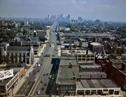 Looking south along Woodward Avenue from the Maccabees Building at Warren Avenue, with downtown Detroit in the distance. July 1942. View full size. 4x5 Kodachrome transparency by Arthur Siegel. Note the four yellow streetcars.
