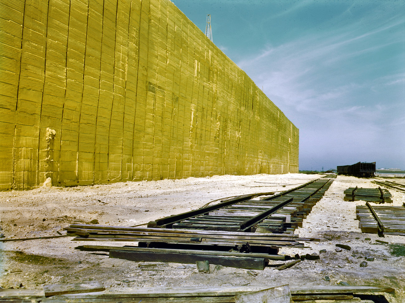Extracted sulfur stacked in a "vat" 60 feet tall at Freeport Sulphur Co. in Hoskins Mound, Texas. View full size. 4x5 Kodachrome transparency by John Vachon.