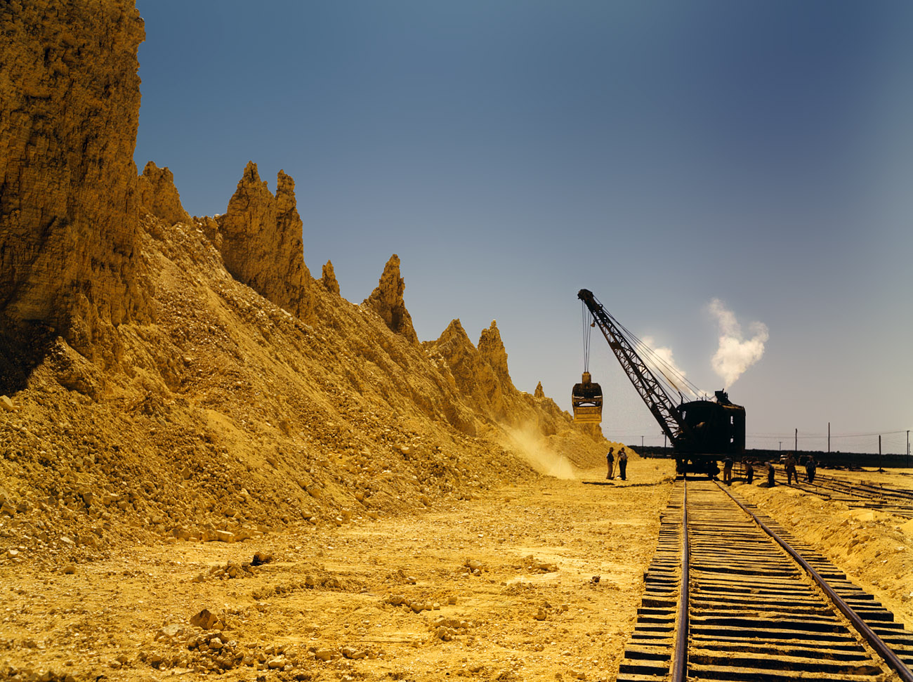 May 1943. "Nearly exhausted sulfur vat from which railroad cars are loaded. Freeport Sulphur Company at Hoskins Mound, Texas." View full size. 4x5 Kodachrome transparency by John Vachon, Office of War Information.