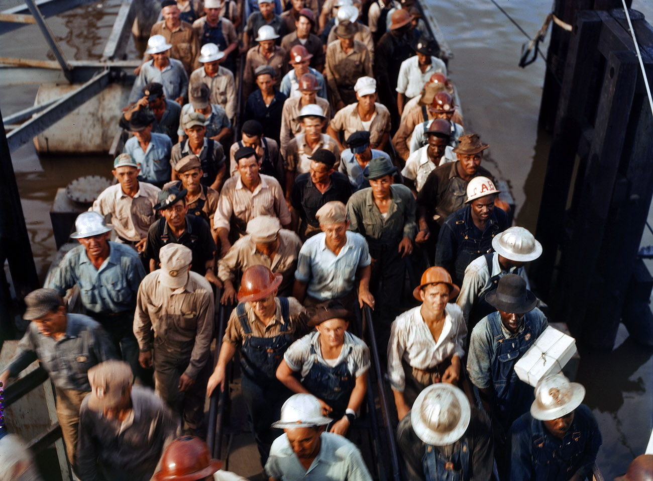 June 1943. Workers leaving the Pennsylvania shipyards at Beaumont, Texas. View full size. 4x5 Kodachrome transparency by John Vachon.