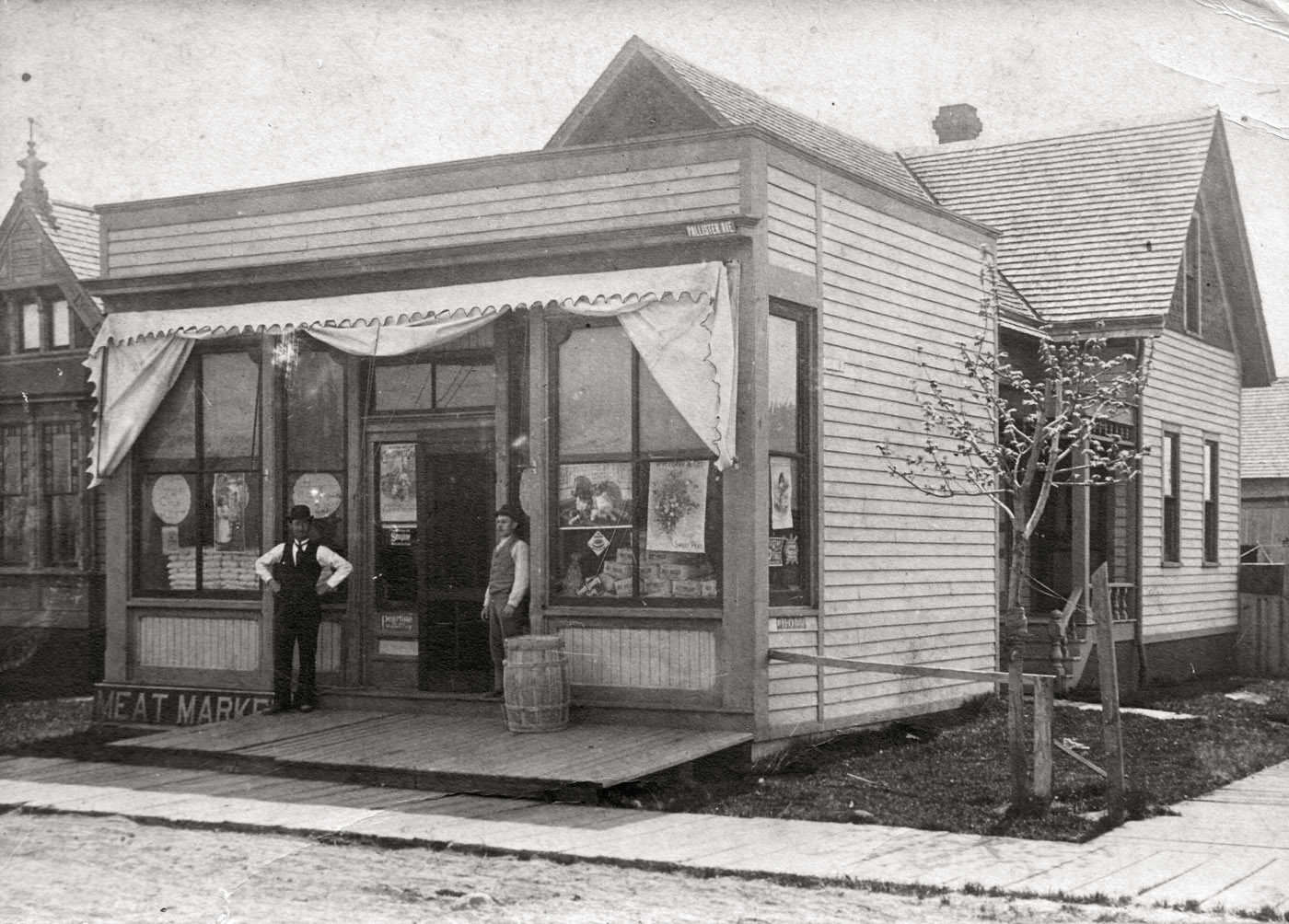 The family grocery store of Conrad Volkert (1871 - 1935) of Detroit, about 1900.  This store was at 24th and W. Warren on Detroit's near west side. None of the buildings shown exist today. View full size.