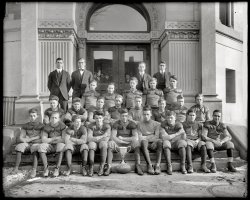 Washington, D.C., 1913. "Technical High School. Football team." Some of the nicest chaps you'd ever want to meet. Harris &amp; Ewing Collection. View full size.
What gets me about group photos....is how you can look over the group several times, and not see some of the people. You just kind of glance right past them, while some stand out. There are times where you really have to make an effort to make sure you look at each person. The ones you look past would make good spies. They blend.
Also, isn't that Dr. Evil's son second on the left, center row?
SpikelessSome of these guys seem to be wearing their dress shoes, and the one fellow has no laces in his.
You on the far right, front rowMy heart has melted.  Sigh.
Original Moptops!With each of these photos featuring early twentieth century boys, a particular thought always comes to mind. Why were the conservative 50's-60's era parents so aghast by the Beatles "radically long" hairstyles? They saw hair just as long on the childhood photos of their own parents!
1913 Static Electricity TestsYou'd act like a nice chap too if every time the group standing in suits behind you took your picture, they jolted you with 6 volts of electricity. Notice almost nobody is smiling, but many of them have hair standing on end. As for the wardens watching from behind the doors, with hats on ...
WonderingPhotos like this always make you wonder who these young men were, what became of them, did they survive WWI, and why the folks looking through the glass couldn't make the team.
Tech RosterAccording to contemporaneous newspaper accounts.  The names on the Tech roster are listed below.  The newspaper articles don't list separate defensive/offensive lines.  Was it the protocol of the day that the same players would play offense and defense?

L.E. - Roberts
L.T. - Boryer
L.G. - Harrison
Center - Gibson
R.G. - Easter
R.T. - Supplee
R.E. - Putnam
Q.B. - Steed
L.H. - Ochsenreiter
R.H. - Hardell
F.B. - Parker

Addition listed names include Fraser, Hart, McCarthy, Gude, White, and Felt
The stars of the team appear to be "Gene" Ochsenreiter, "Jakey" Roberts, Easter &amp; Supplee

Matches on their 1913 schedule:

Episcopal High (Alexandria)
Navy Plebes (Annapolis)
Business High
Army and Navy Preps
Central High
George University Preps
Western High
Eastern High

HardheadsI don't see any kind of headgear anywhere.  Is this before they were even known as "leatherheads?"
[They wouldn't be wearing their headgear for a team portrait. - Dave]
Bully for youMore than one of these guys looks like he made life absolute hell for some poor freshman. Particularly Mr. Cro-Magnon in the bow tie.
Technical High SchoolThis was the McKinley Technical High School.  The building still stands at 7th and R Streets NW.  It's now housing for seniors, and is named the Asbury Dwellings.
The school opened as Technical High School in 1902 and was almost immediately renamed McKinley Technical High School.  McKinley moved into a new building in 1928, and this building was transferred into the part of the school system for African American children.  It was known as Shaw Junior High School from 1928 to 1977.
These are some other images of the school that you've posted:
https://www.shorpy.com/node/5413
https://www.shorpy.com/node/5799
(The Gallery, D.C., Harris + Ewing, Sports)