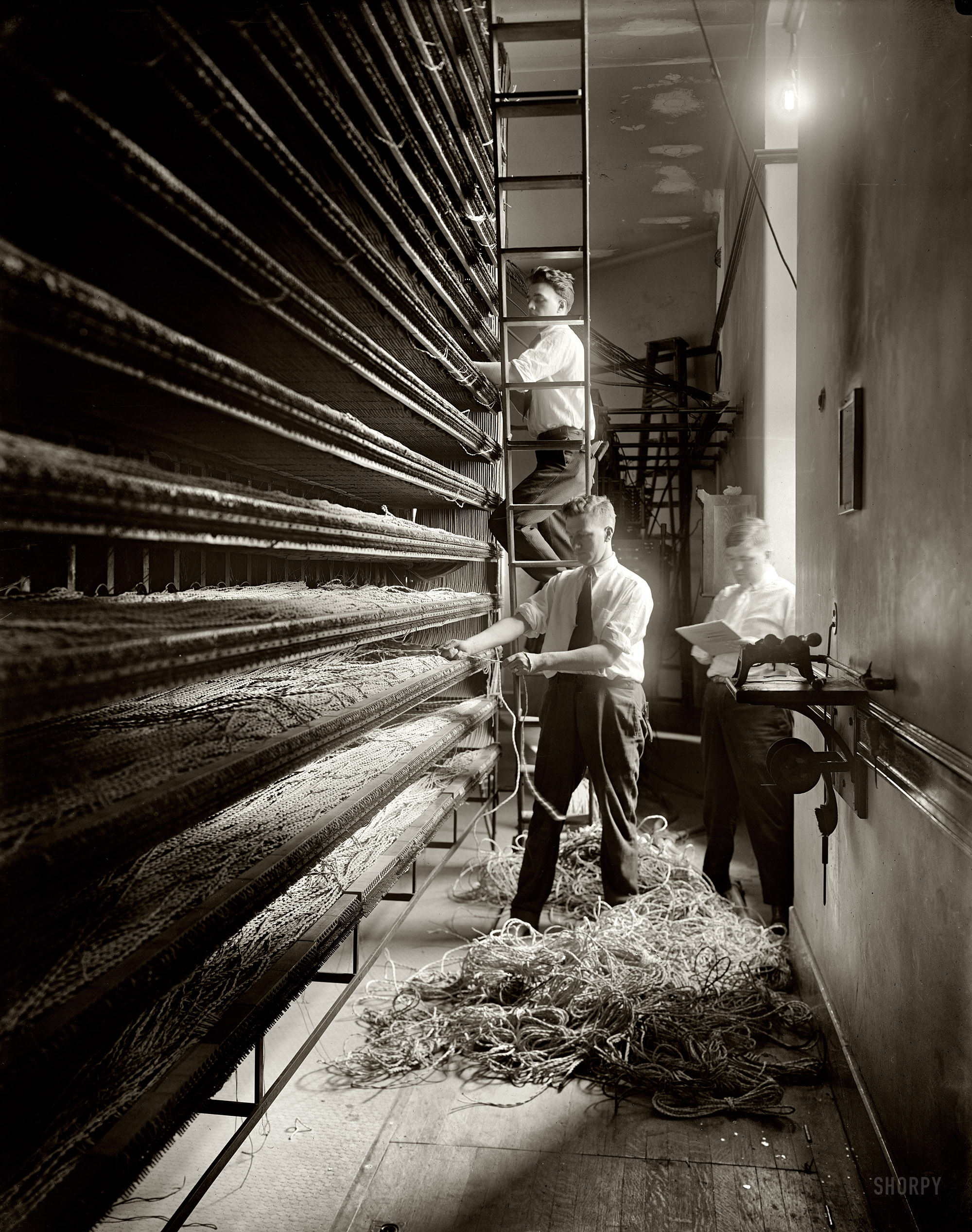 Washington, D.C., circa 1919. "Chesapeake & Potomac Telephone Co. wiring." A behind the scenes look at communications tech some 80 years after the telegraph tapped out its first message. Harris & Ewing glass negative. View full size.