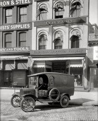 Washington, D.C., circa 1919. "Underwood Typewriter Co., 1413 New York Avenue N.W." Harris &amp; Ewing Collection glass negative. View full size.
PerfectWhat a wonderful Ford truck!  Beautifully done, lovely proportions. All it needs is a 428!
Welcome HomeIt looks like the owner of the store must have had a son in the military during WW I. There's a photo of a soldier in the window, with a "Welcome Home" banner just above it. Since the photo is dated 1919, the timing would be right for a soldier returning from Europe.
[The "Welcome Home" is directed to potential customers. - Dave]
U Turn"Positively No Parking Here" -- unless you're posing for a picture
Lambie Hardware

Washington Post, Feb 17, 1956 


Hardware Store to Close Doors

The James B. Lambie Co., Inc., at 1415 New York ave, nw., one of Washington's oldest hardware stores, will soon close its doors.
Henry F. Broadbent, 75, president of the company, said the 75-year-old store will close "as soon as I finish cleaning out," which he expects will be in a couple weeks.
He said, "Business hasn't been so good and we just decided to quit, that's all."

Nice detailThere's some attractive masonwork in the pillar in the right hand side of the photo. No fancy moulded brick, just something that could be done with a brick hammer and chisel. I wonder if it was part of the architect's design or a flight of fancy for the brick mason.
Carriage ReturnThe truck looks a bit like an old Underwood typewriter. That same dark metal.  You can just hear the keys clicking, the carriage sliding along its bed, until it hits the bell and "ding!"  I miss that sound.  I keep meaning to dust off my old Underwood and get back to real writing!
[Also note that someone misspelled "typewriter" on the truck. - Dave]
Typewriter SongRemember the great "Typewriter Song"?  There is a great free version of it on the internet by "The Boston Pops".  Every time I hear a typewriter or think of the word, it reminds me of that song.
It&#039;s the early 20th C version of the Apple StoreWhat's the typeface used for the store sign?
SprocketsCan some antique car enthusist explain the sprocket arrangement on the passenger side front wheel. Early 4WD maybe?
That sprocketThe "sprocket" is actually a gear used to drive the speedometer cable. These were used on many different cars and trucks of the era.
Bricks and mortarYou can almost hear the bricklayers pissing &amp; moaning about all the extra work to make a teardrop shape that nobody will even notice.   True craftsmanship, though.
Citroen 2CV 1955in the early 60's I drove a Citroen 2CV 1955 that had some nice features.
First there was a speedometer driven by cable. The screen wipers were driven by the same cable, which meant that the speedometer needle would start to shake whenever the wipers were put on.

But it had also a very special fuel meter: it had a long (about 3 ft) fiber gauging rod, hanging down from the fuel tank entrance. If you wanted to know the fuel level you simply swung the rod a few times around in the air, to get it dry, and then dipped it in your tank, the fuel level could be read from the rod by means of an imprinted scale on it.

By the way: it was a pefect camper for me and my friend, you just took out the seats, and you had a flat surface to put your air-beds on (how modern). You even could drive, sitting on the floor, to the village water pump to wash you face the next morning!
(The Gallery, Cars, Trucks, Buses, D.C., Harris + Ewing)