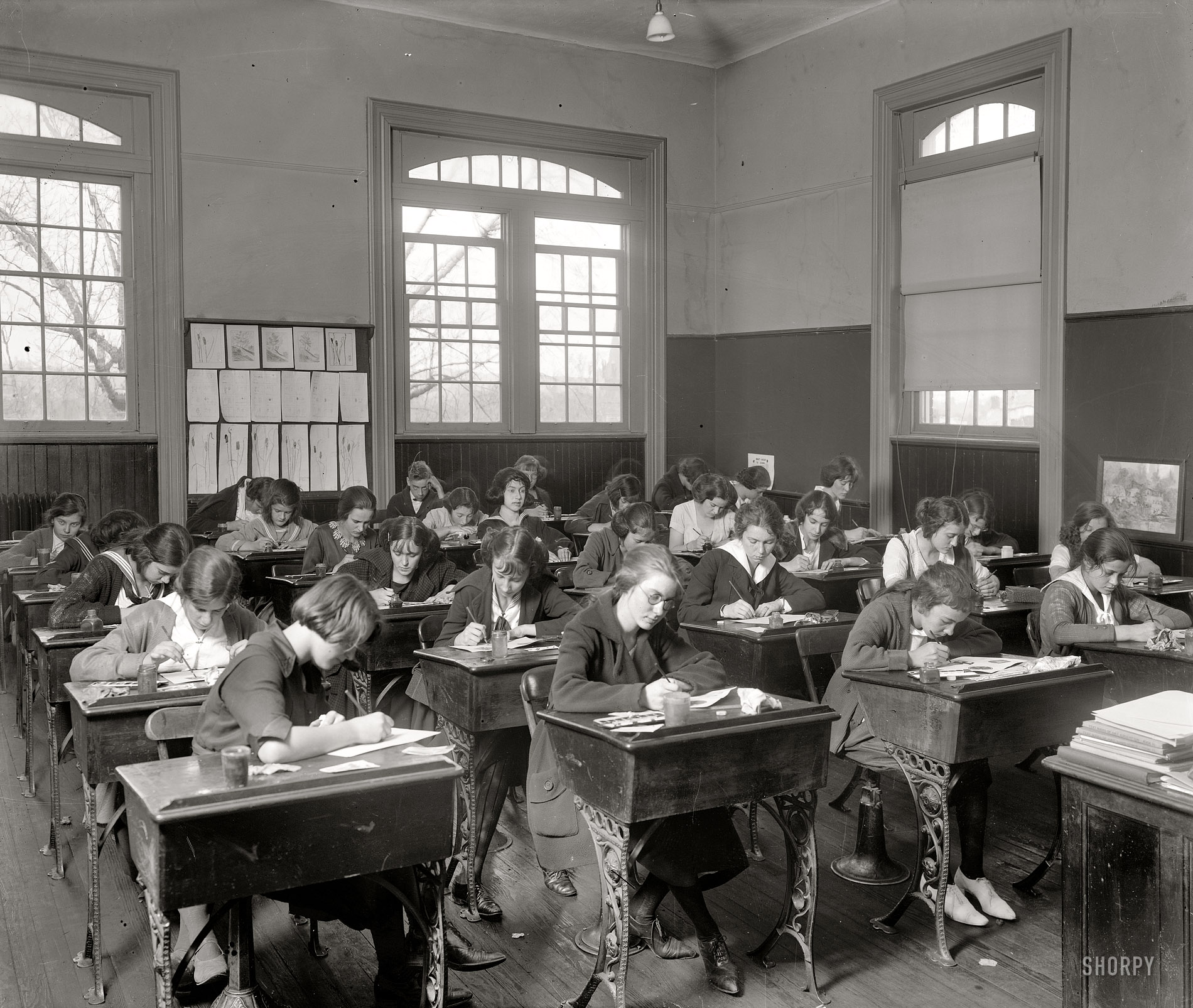 "Junior high school classroom." With one lucky (?) boy in the back. In or around Washington, D.C., circa 1921. Harris & Ewing glass negative. View full size.