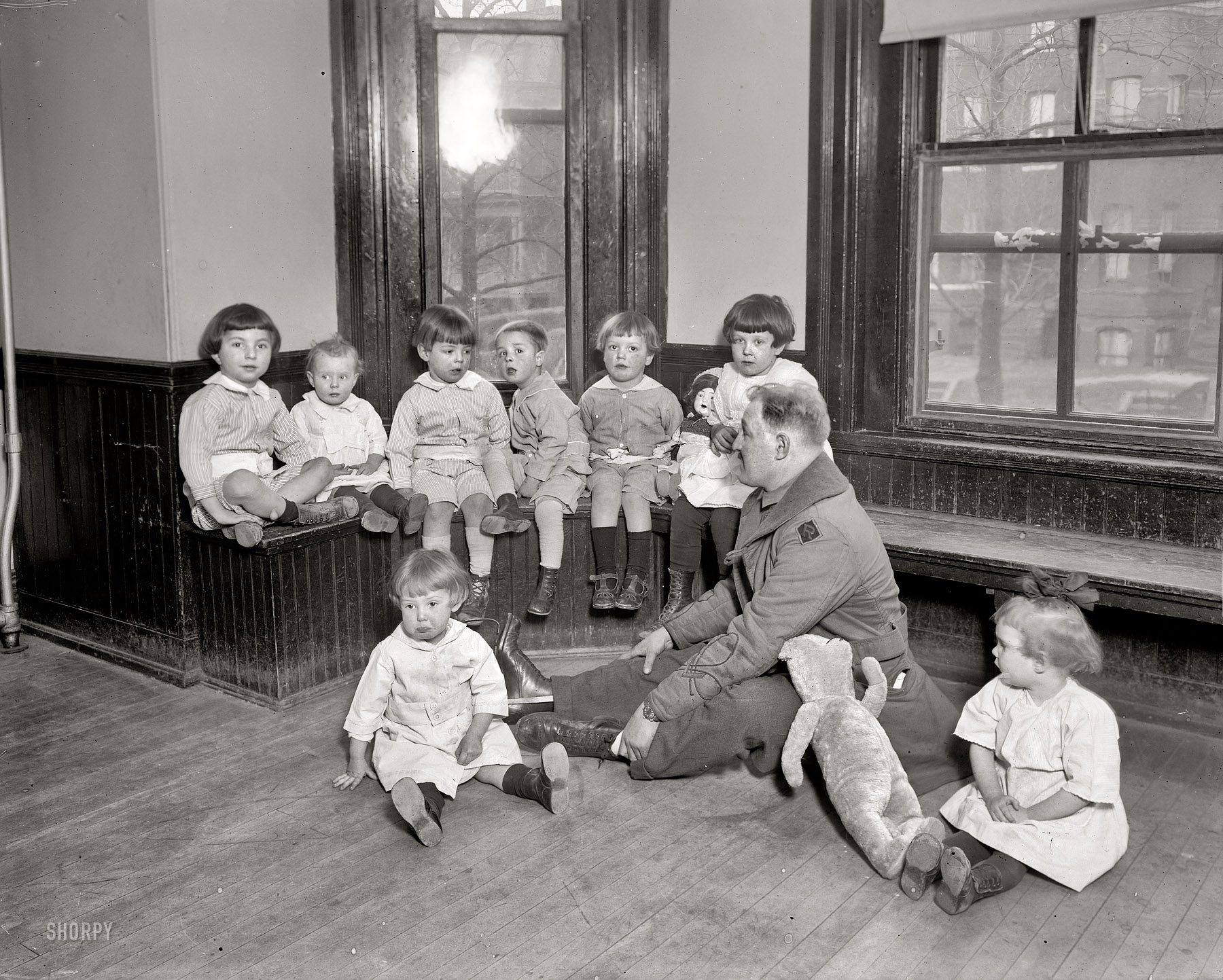 Washington, D.C., circa 1921. "Foundling Hospital playroom." Another look at Lieutenant George Pickett III and tots at the Washington Asylum for Foundlings (generally, babies found after being abandoned by their mothers shortly after birth -- think basket on a doorstep with a note attached). Lieut. Pickett was manager of a fund drive that sought to raise $10,000 for the kids. View full size.