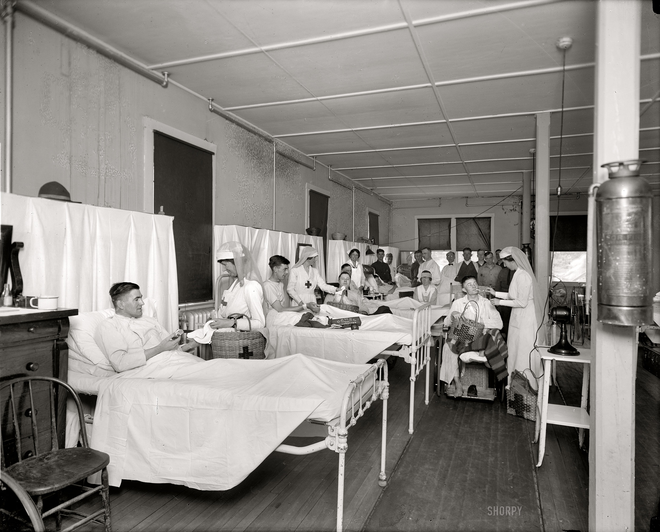 Washington, D.C., circa 1918. "Red Cross activities at Walter Reed Hospital." Cigarettes for the wounded back from the trenches of Europe. Harris & Ewing Collection glass negative. View full size.