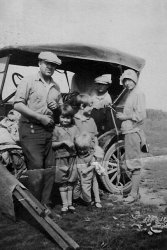 My great-grandfather Grant Webb Sr. with most of the family, still putting out to Yellowstone in the 1920's. Traveling in those old rickety cars, roads mostly of mud, must have been quite an adventure. The trip was from Burley, Idaho to Yellowstone.
(ShorpyBlog, Member Gallery)