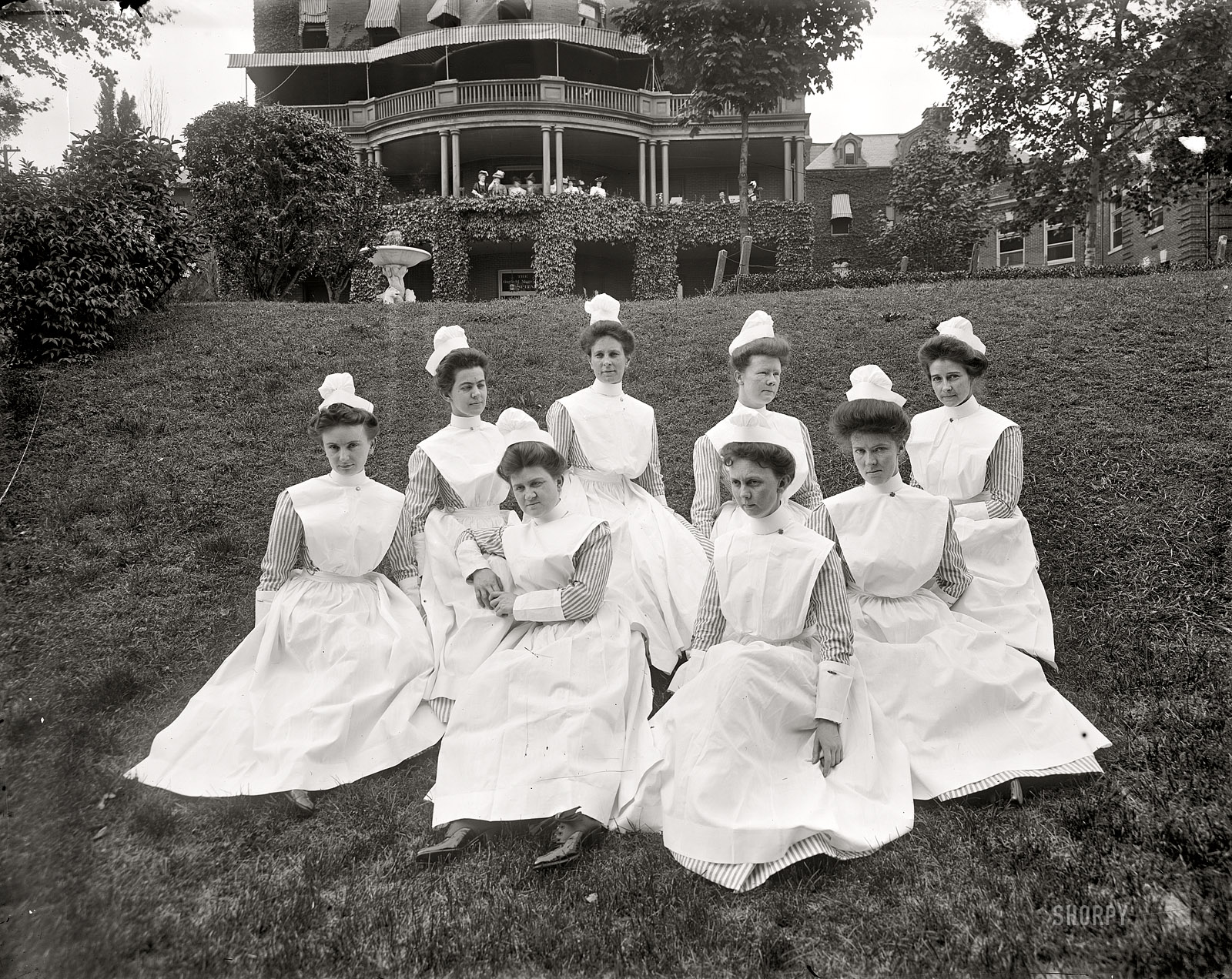 Washington, D.C., circa 1910. "Portrait of nurses on lawn." Harris & Ewing Collection glass negative. View full size.