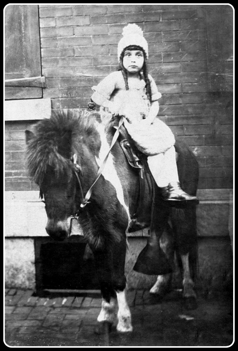 My mother Evelyn Ziv Blass (1915-2006) at age seven, obligatory pony picture taken in Philadelphia's Strawberry Mansion neighborhood. View full size.