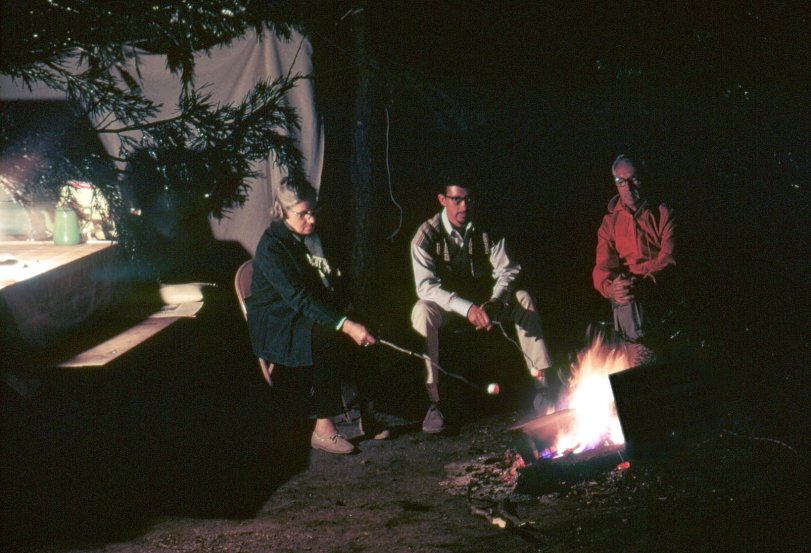 July 1967, Kings Canyon National Park, California. My mother, brother and father around the campfire, photographed in Kodachrome by the light of a Coleman lantern. Bonus: antique enameled coffeepot. View full size.
