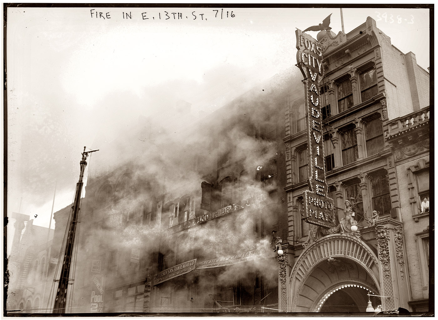 June 29, 1916, fire at the Fox Playhouse between East 13th and 14th Streets. Tenants in the building owned by restaurateur August Luchow included the vaudeville house (showing "photo plays"), Loewinger Brothers printers, a pool hall and Greater New York Film Rental. We also see women at two of the windows. View full size. 5x7 glass negative, George Grantham Bain Collection.