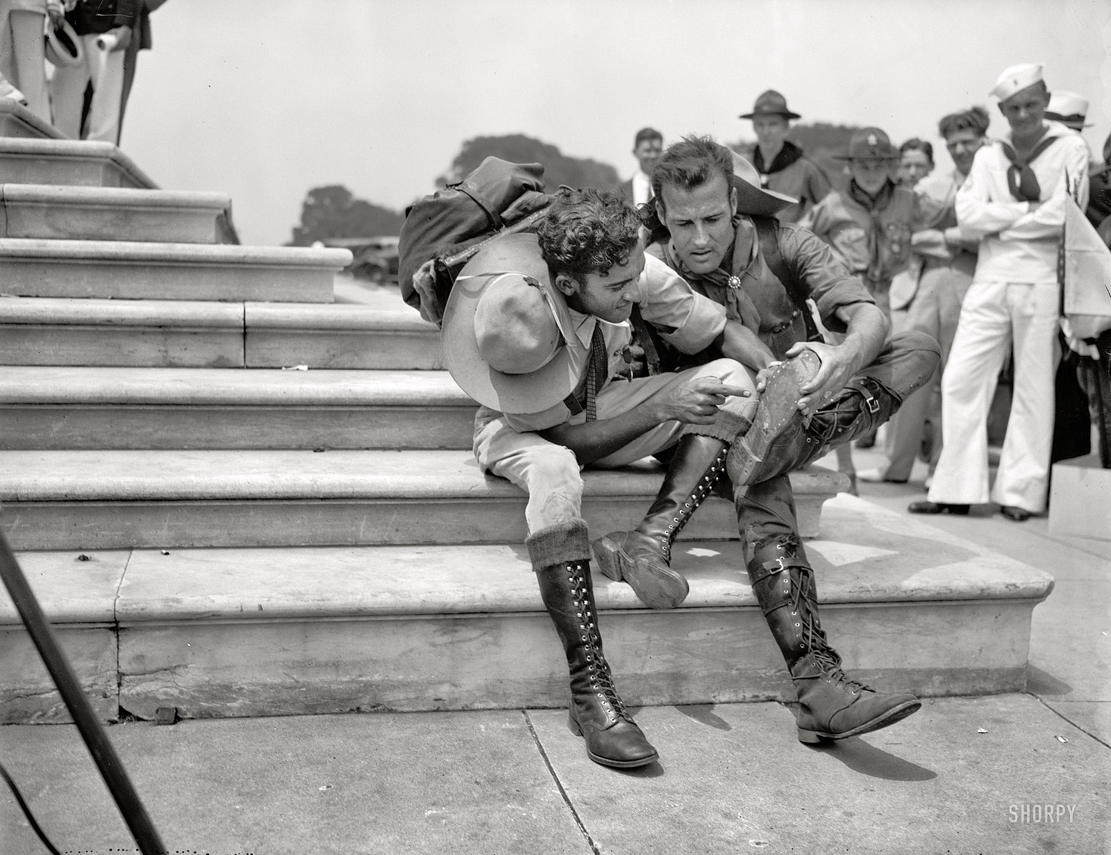 June 16, 1937. "Walk 800 miles to attend Boy Scout Jamboree. Two Venezuelan Boy Scouts, Rafael Angel Petit, left, and Juan Carmona, examining their boots after tramping 25 miles a day for two years in order to attend the Boy Scout Jamboree in Washington. They left Caracas Jan. 11, 1935, arriving in Washington today." Harris & Ewing Collection glass negative. View full size.