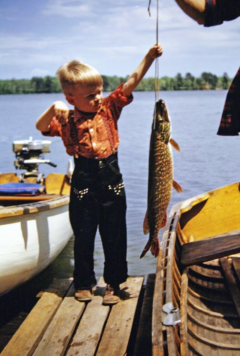 I once caught a fish almost as long as I was tall. Year -- probably 1950. I'm not sure of the lake, except that it was one of Minnesota's 10,000. I can't explain the pants I am wearing. View full size.
