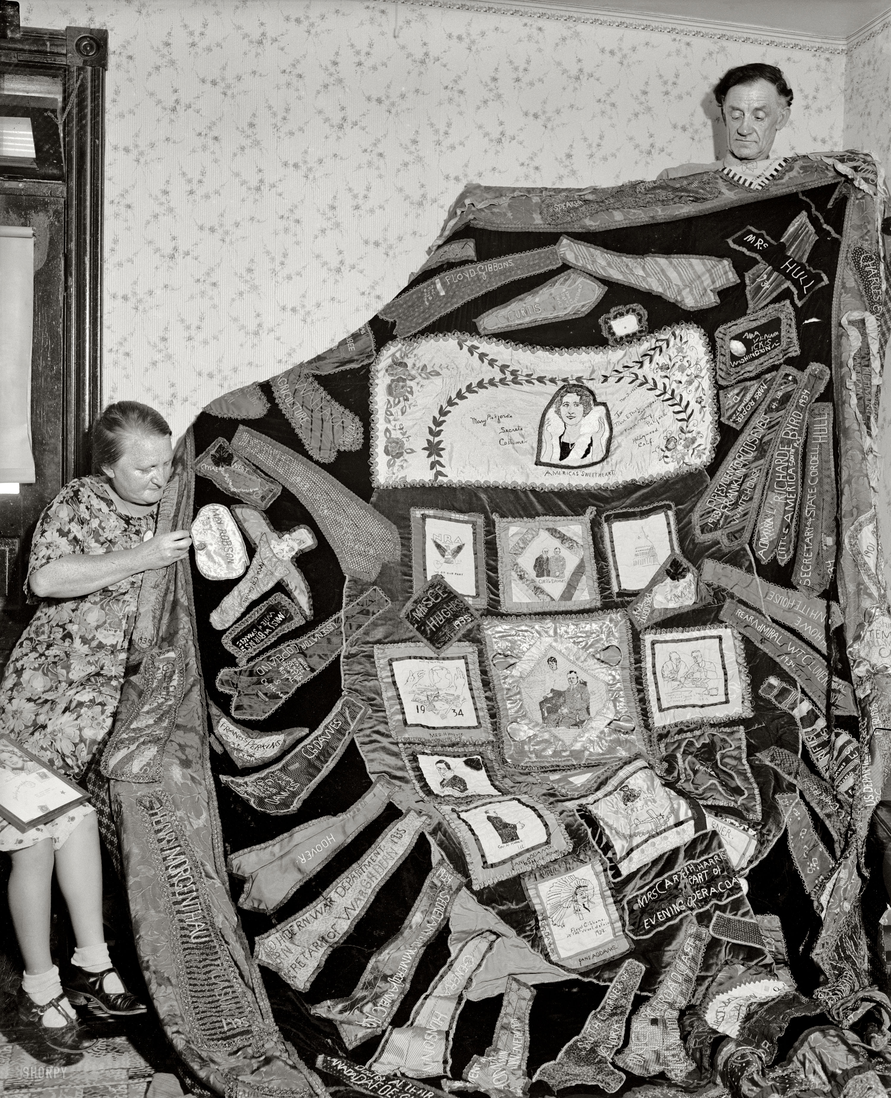 August 17, 1937. "Joseph's coat of many colors had nothing on this unique quilt which is now being completed by Mrs. Ethel Sampson of Evanston, Ill., after six years of collecting. Parts of wearing apparel from President Roosevelt, Mrs. Roosevelt, members of the Cabinet, diplomats and notables from all over. From Hollywood, Bing Crosby sent a tie while Mae West and Shirley Temple contributed parts of dresses. Former Emperor Haile Selassie's neckties and a linen of Windsor are also included on the quilt. Diapers from the Dionne Quintuplets are also prominently displayed." Harris & Ewing glass negative. View full size.
