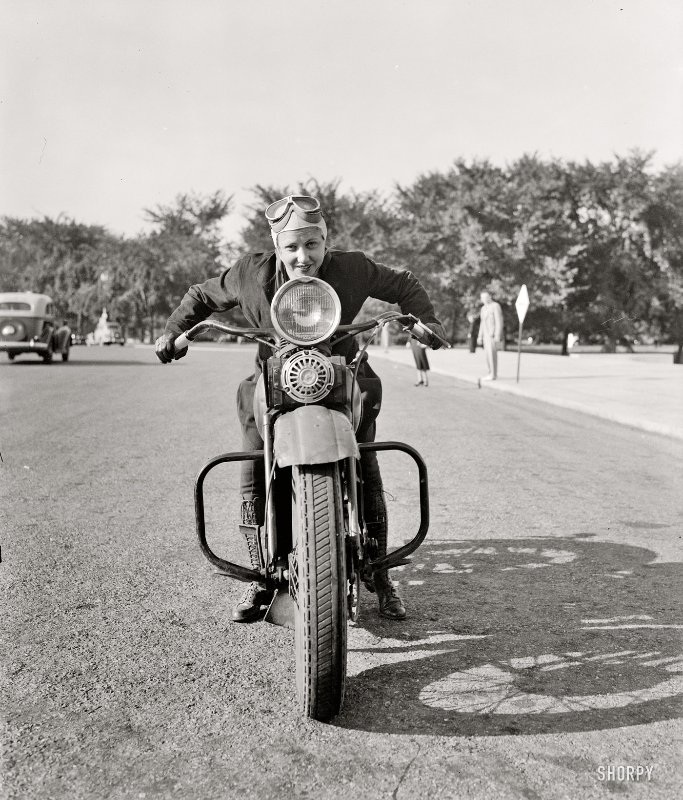 September 15, 1937. "First of fair sex to obtain motorcycle license in Capital. Although she weighs only 88 pounds -- one-third of the machine she rides, Mrs. Sally Halterman is the first woman to be granted a license to operate a motorcycle in the District of Columbia. She is 27 years old and 4 feet, 11 inches tall. Immediately after receiving her permit, Mrs. Halterman was initiated into the D.C. Motorcycle Club -- the only girl ever to be accorded this honor." View full size.
