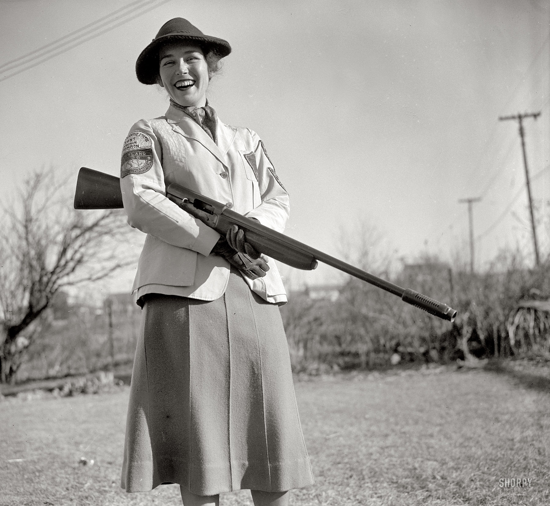 January 5, 1938. Westmoreland Hills, Maryland. "Mrs. Albert F. Walker of this town has been declared 1937 women's skeet shooting champion of the country by the National Skeet Shooting Association. The Association has released the averages on which the ratings were based, but one day last year at the Kenwood skeet club, Mrs. Walker set the women's record fall with 99x100 (skeet for 99 birds out of a possible 100). In addition to her national title, she outranks both men and women shooters in the District of Columbia and Maryland." Harris & Ewing Collection glass negative. View full size.